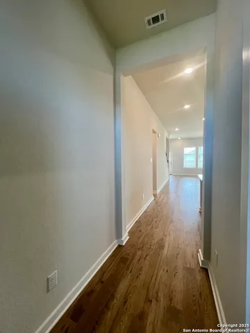 a large kitchen with kitchen island a sink stainless steel appliances and cabinets