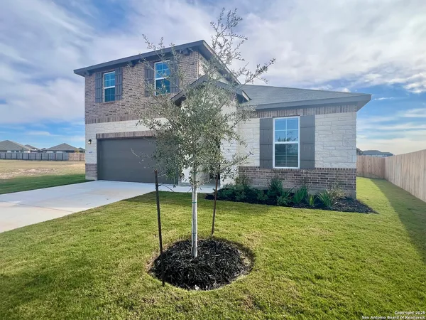 a swimming pool with trees in the background