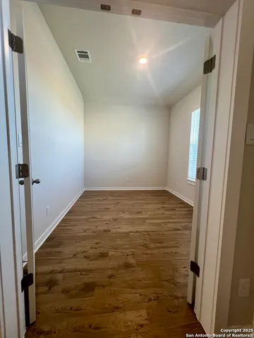 a large kitchen with stainless steel appliances granite countertop a large counter top a sink and a dishwasher