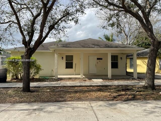 24344 Southwest 130th Place Homestead, FL 33032 - Photo 2 of 9 a front view of a house with a tree