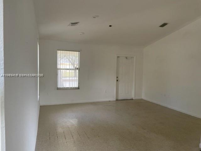 24344 Southwest 130th Place Homestead, FL 33032 - Photo 3 of 9 an empty room with a window
