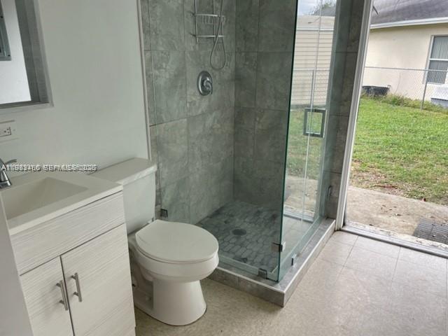 24344 Southwest 130th Place Homestead, FL 33032 - Photo 6 of 9 a bathroom with a toilet and a shower