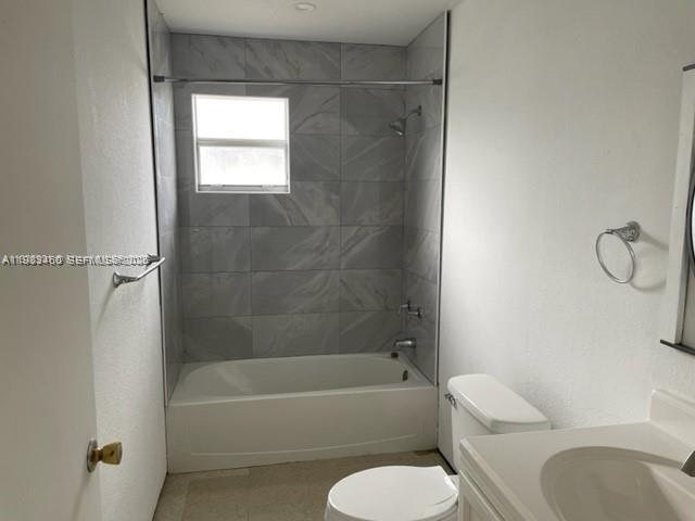 24344 Southwest 130th Place Homestead, FL 33032 - Photo 8 of 9 a bathroom with a toilet and a bath tub