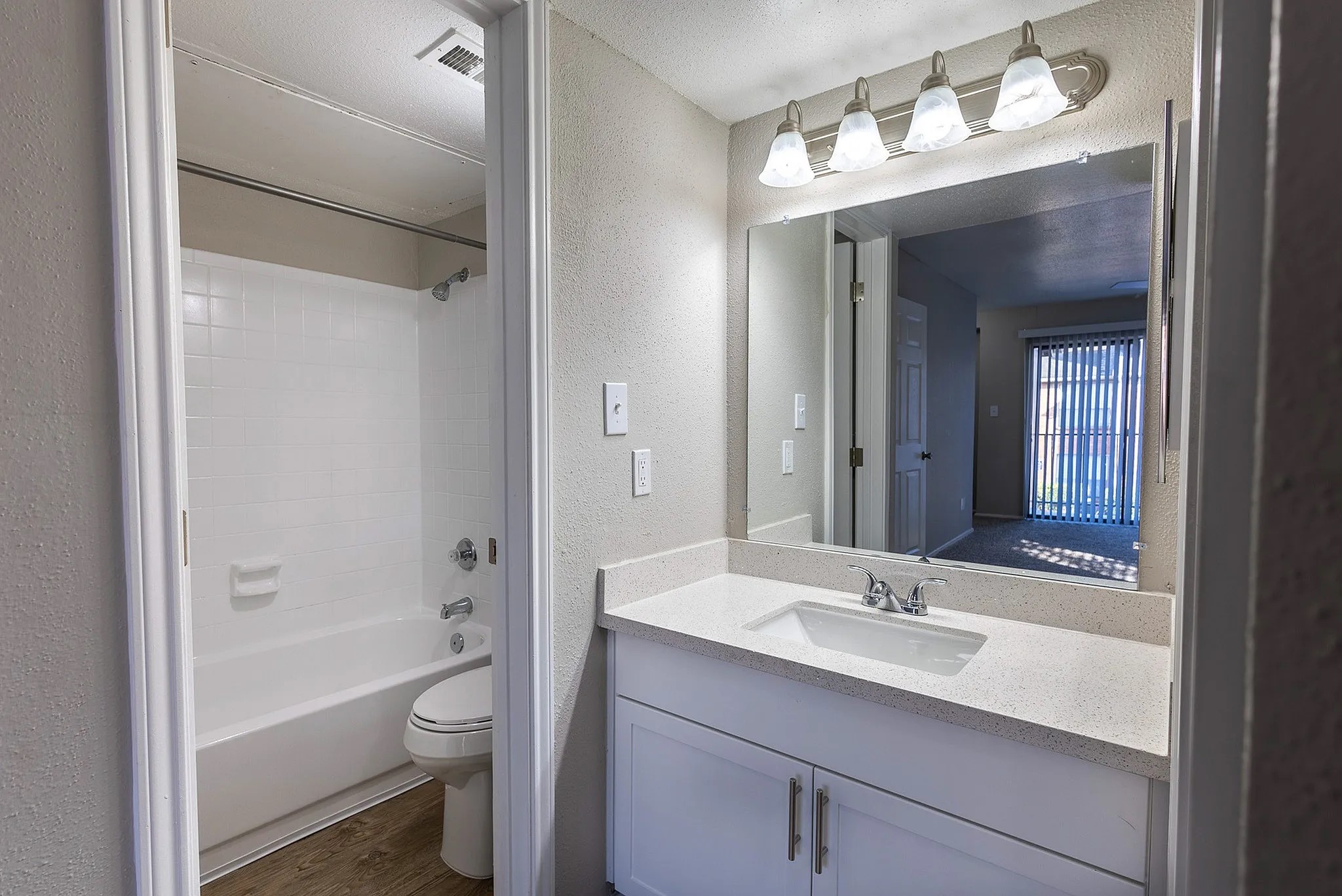 1230 Farm To Market 1960 Bypass Road East, Unit 302 Humble, TX 77338 - Photo 17 of 20 a bathroom with a sink a toilet and shower