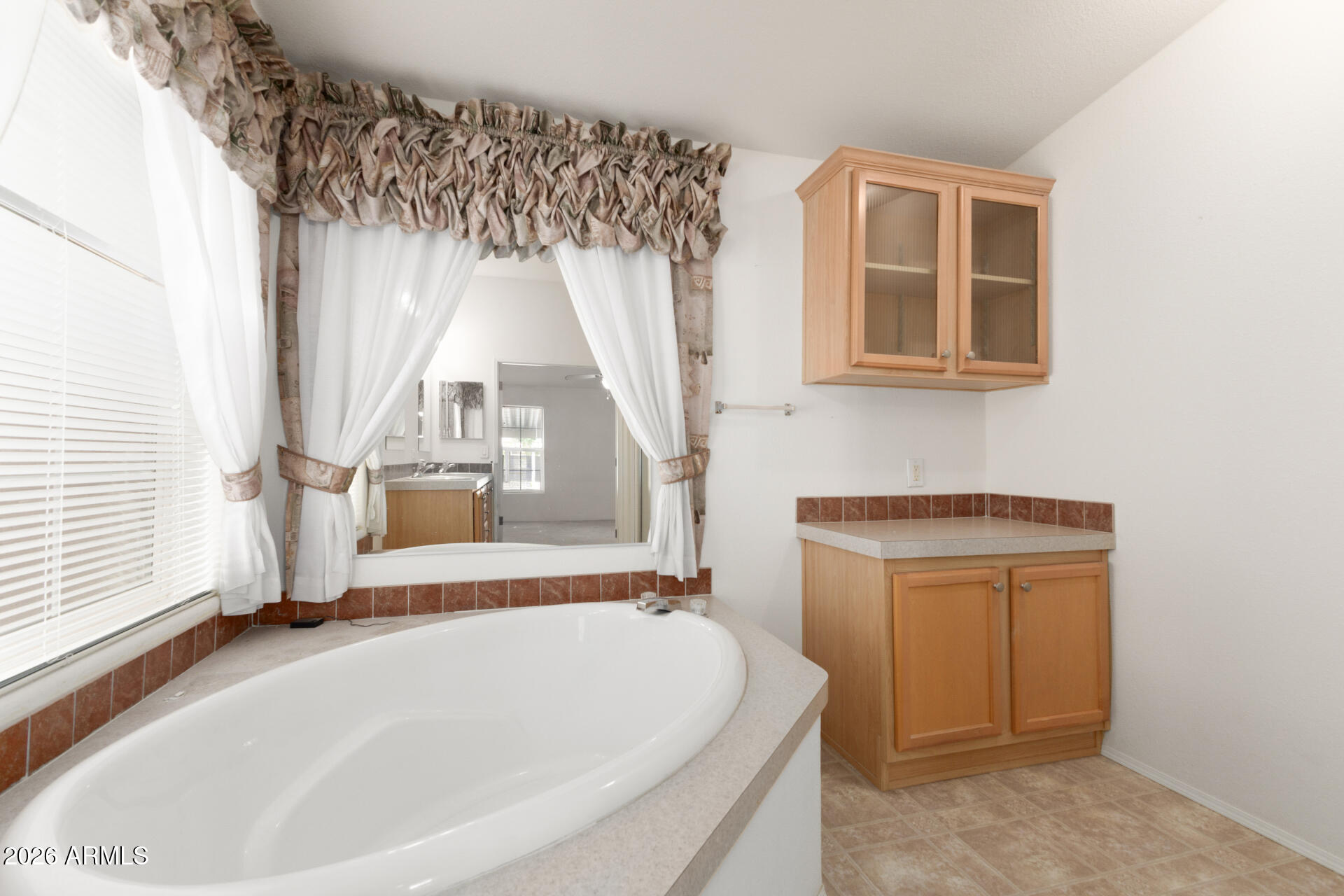 16101 North El Mirage Road, Unit 429 El Mirage, AZ 85335 - Photo 13 of 31 a bathroom with a tub and a window