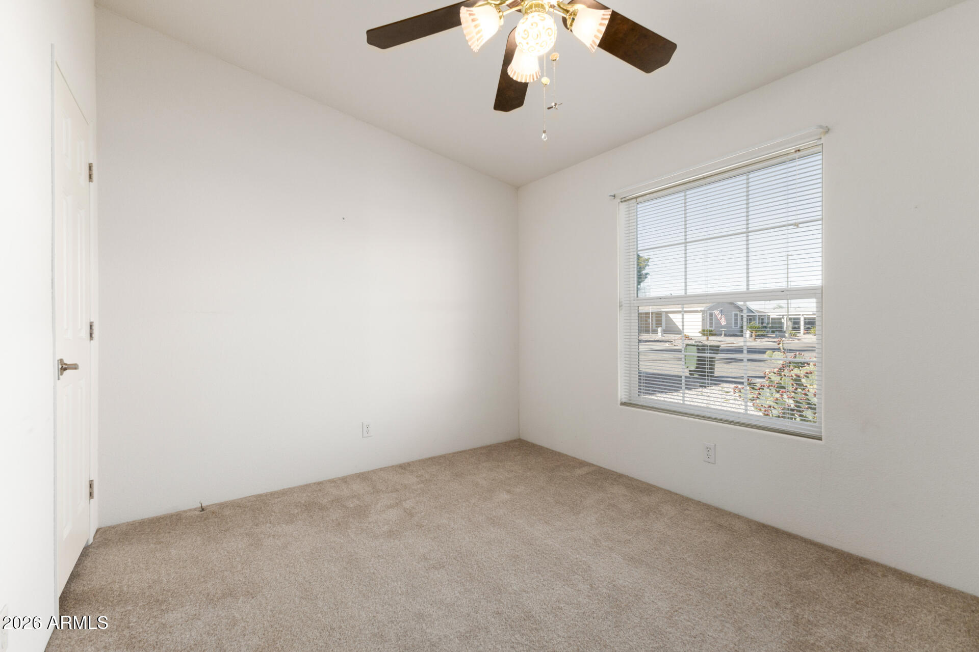 16101 North El Mirage Road, Unit 429 El Mirage, AZ 85335 - Photo 14 of 31 an empty room with a window