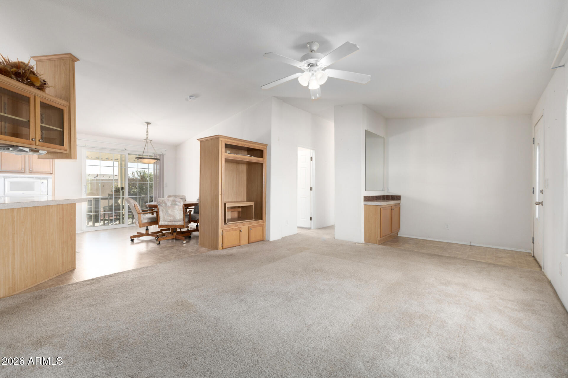 16101 North El Mirage Road, Unit 429 El Mirage, AZ 85335 - Photo 2 of 31 a view of a livingroom with furniture and a ceiling fan