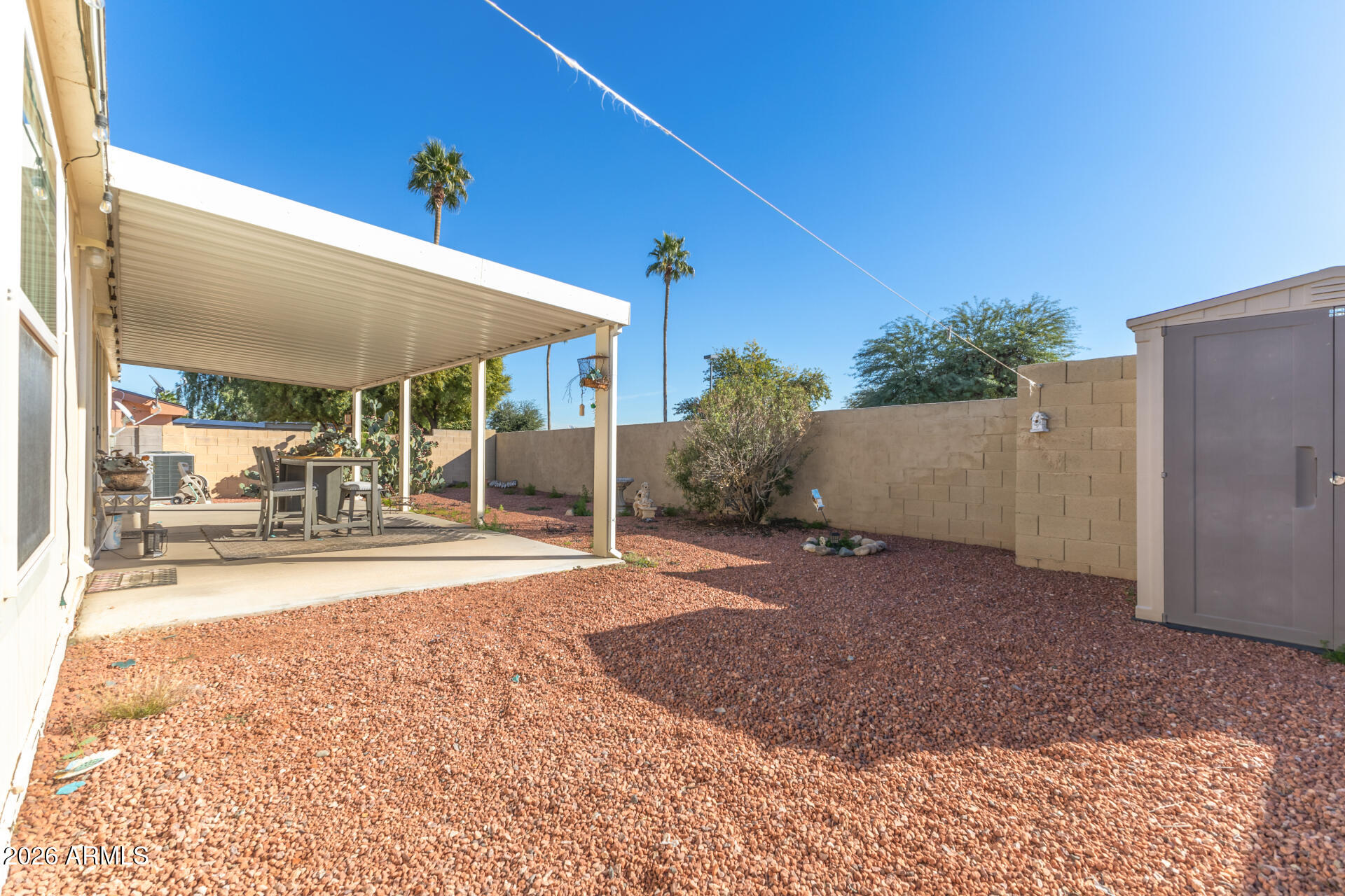 16101 North El Mirage Road, Unit 429 El Mirage, AZ 85335 - Photo 21 of 31 a view of a backyard with a patio