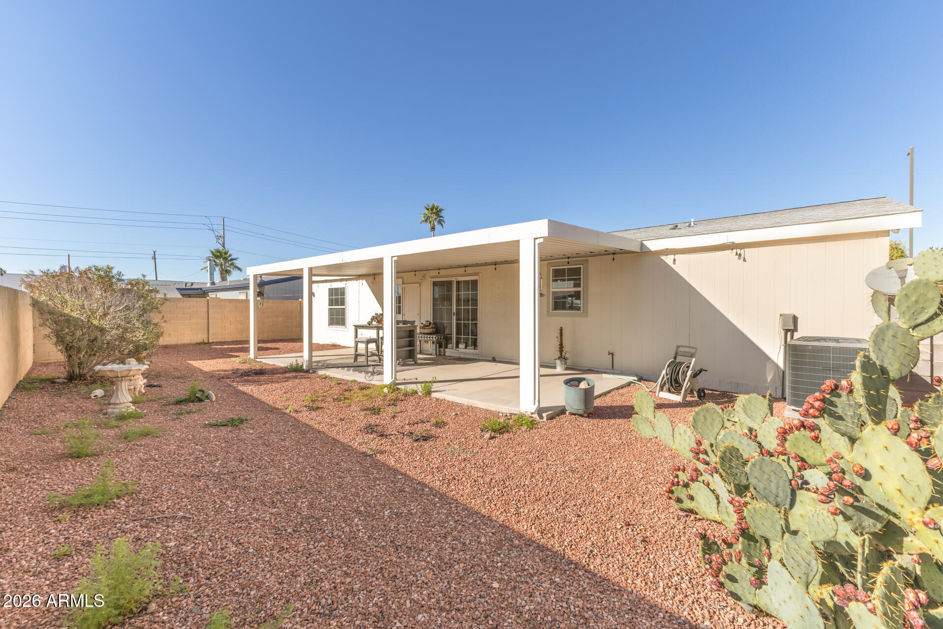 16101 North El Mirage Road, Unit 429 El Mirage, AZ 85335 - Photo 23 of 31 a front view of a house with a patio