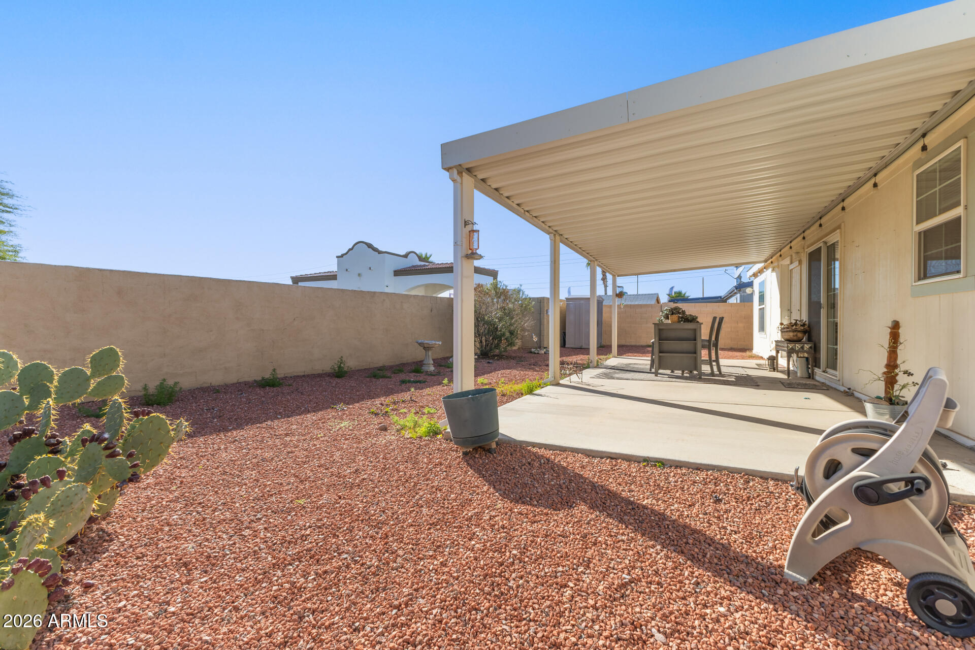16101 North El Mirage Road, Unit 429 El Mirage, AZ 85335 - Photo 24 of 31 a view of outdoor kitchen and front view of a house
