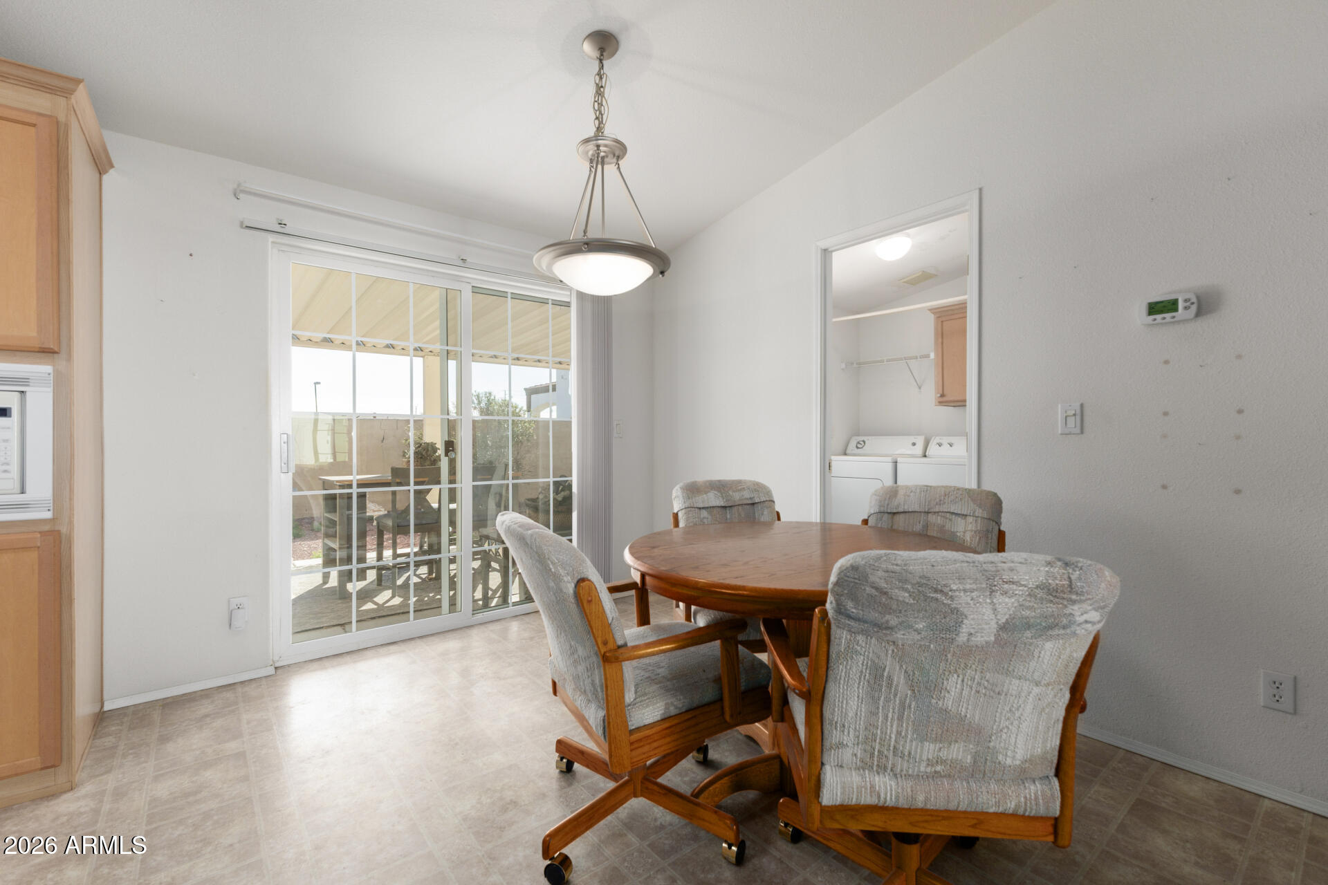 16101 North El Mirage Road, Unit 429 El Mirage, AZ 85335 - Photo 8 of 31 a view of a dining room with furniture window and wooden floor