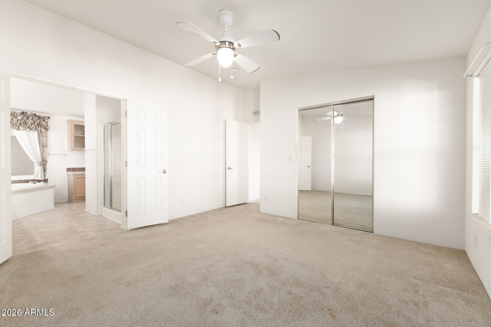 16101 North El Mirage Road, Unit 429 El Mirage, AZ 85335 - Photo 10 of 31 an empty room with a bathroom and a shower