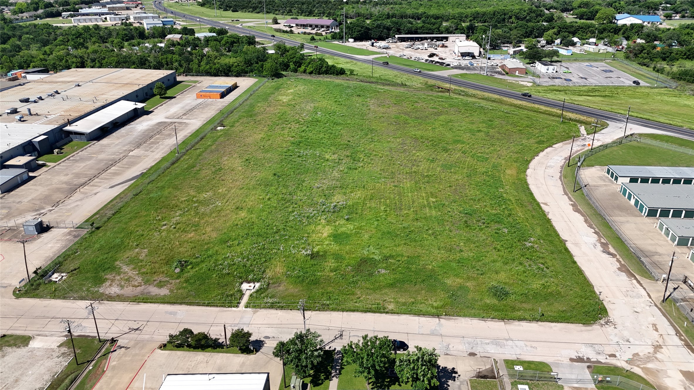 1401 Jack McKay Boulevard Ennis, TX 75119 - Photo 2 of 8 an aerial view of a house with a garden and swimming pool