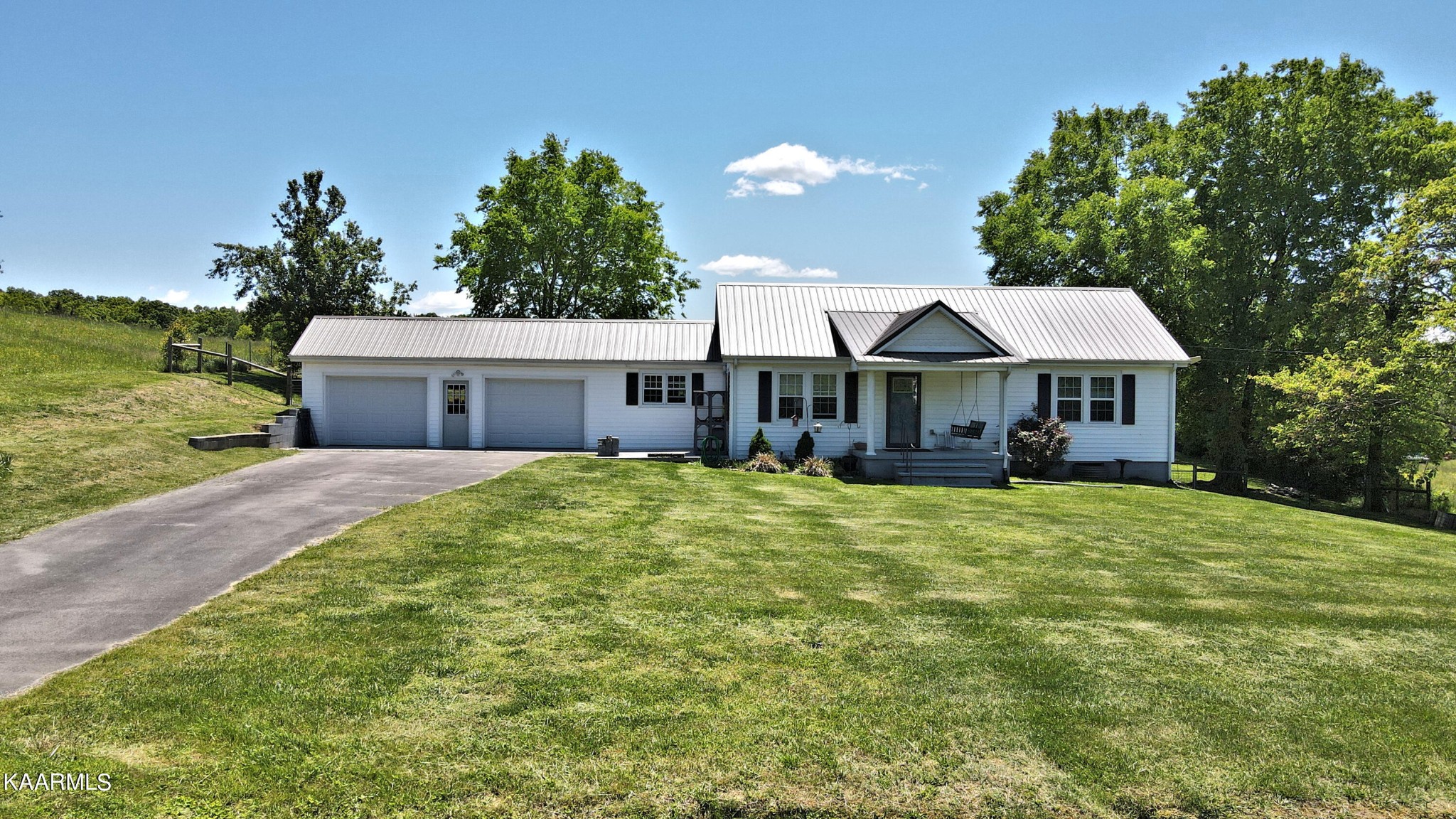 577 Wells Spring Road Dandridge, TN 37725 - Photo 1 of 28 a front view of a house with a yard