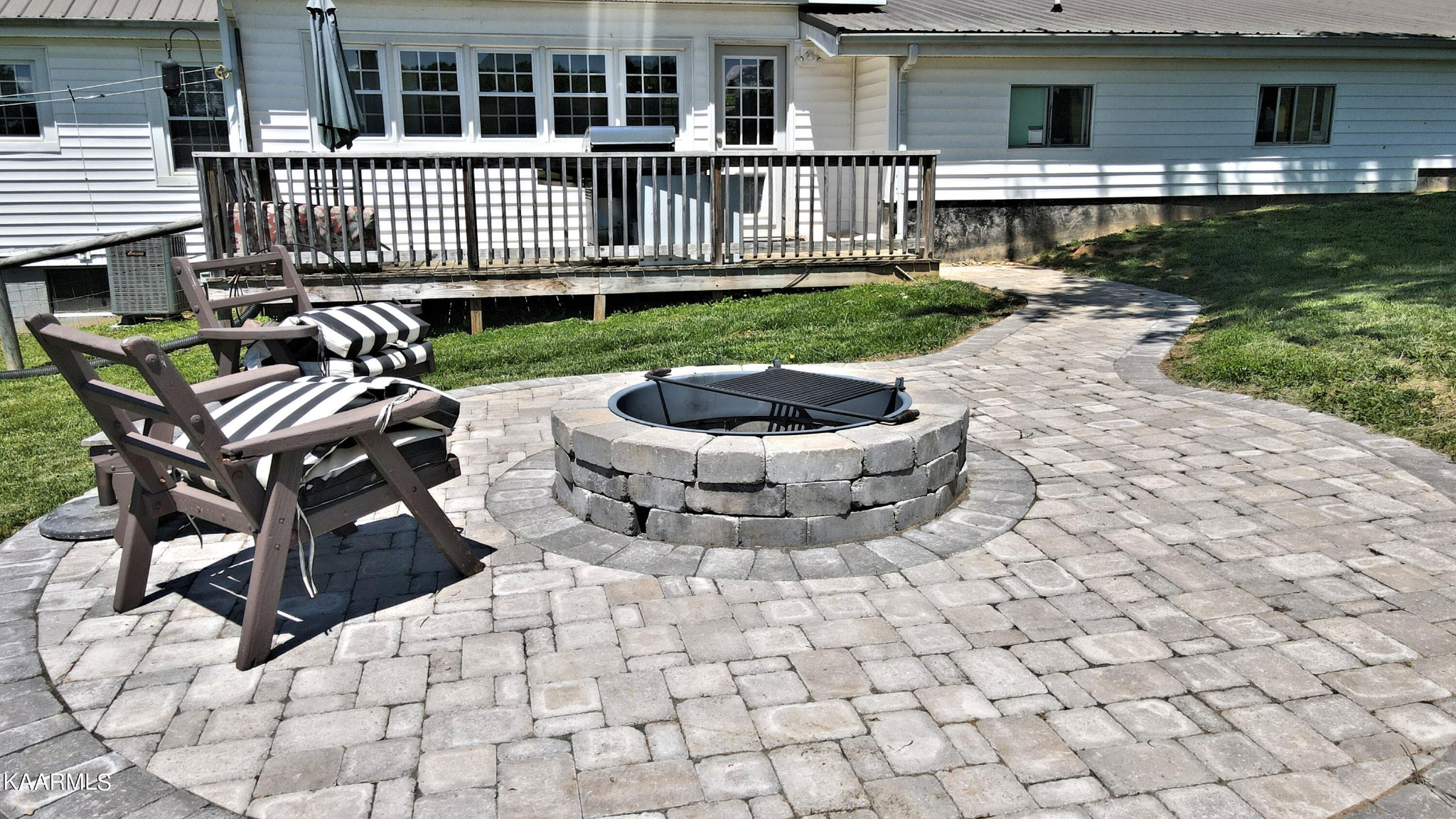 577 Wells Spring Road Dandridge, TN 37725 - Photo 9 of 28 a view of a house with backyard sitting area and garden
