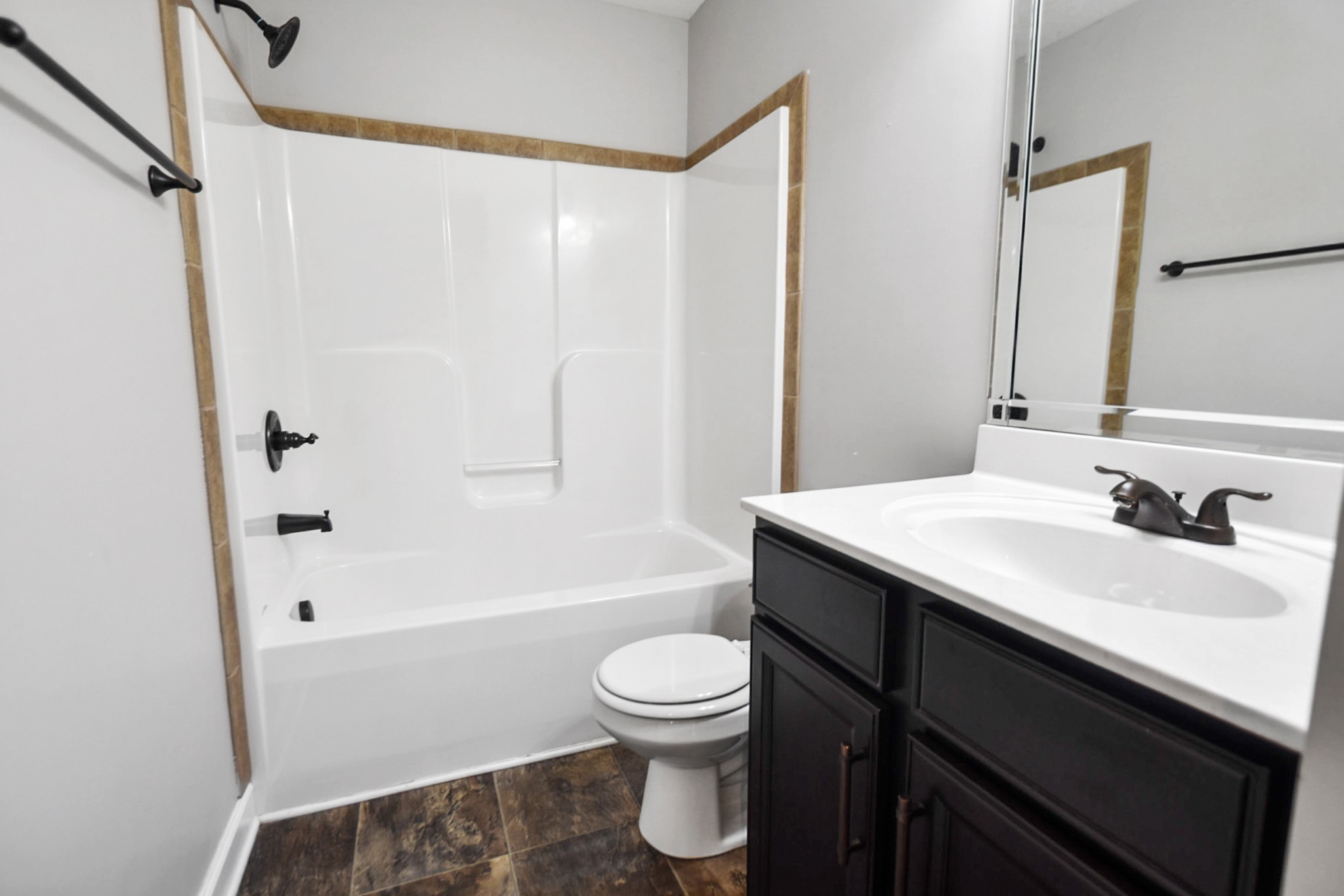 3710 Suiter Road Clarksville, TN 37040 - Photo 13 of 18 a bathroom with a sink a toilet and a bathtub