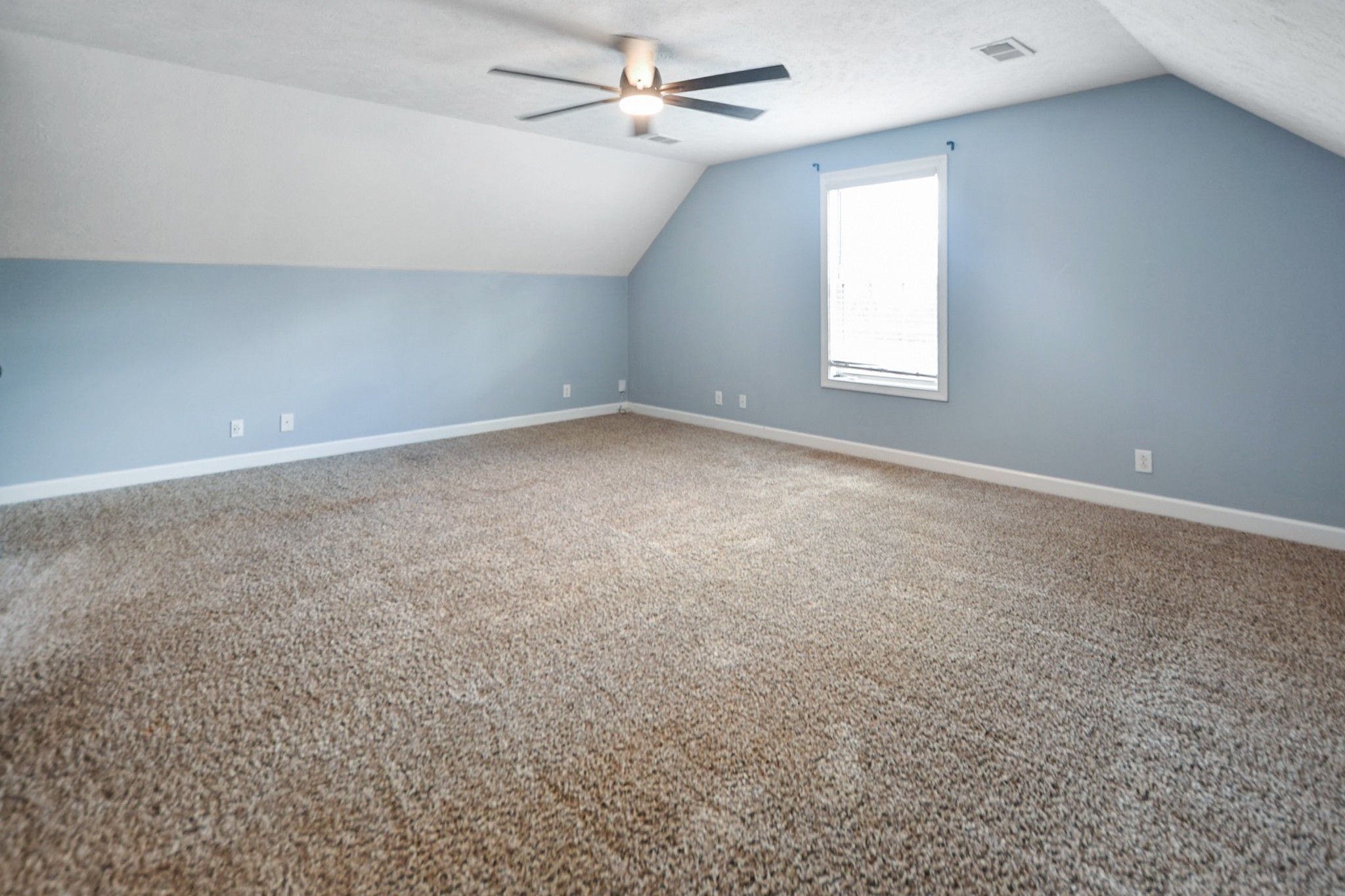 3710 Suiter Road Clarksville, TN 37040 - Photo 15 of 18 an empty room with windows and ceiling fan