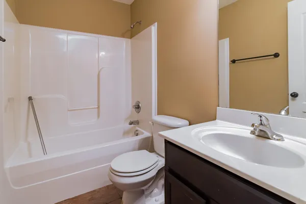 a bathroom with a sink a toilet and a bathtub