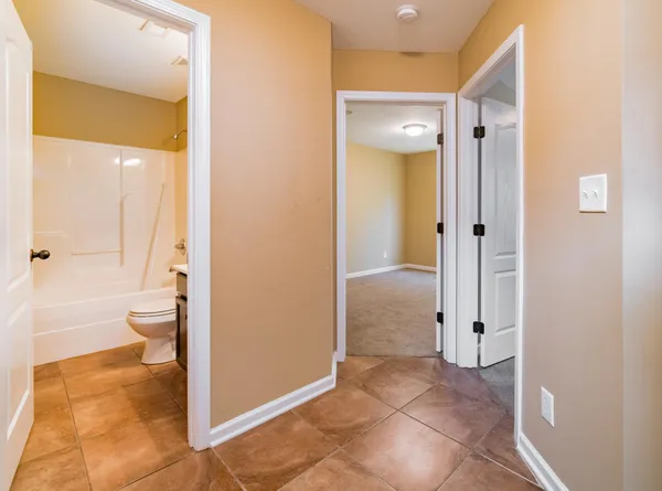 a bathroom that has a glass shower door