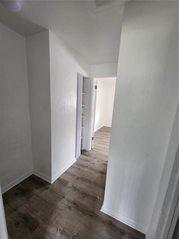 806 Southwest 64th Terrace, Unit C Gainesville, FL 32607 - Photo 15 of 28 a view of a hallway with wooden floor and entryway