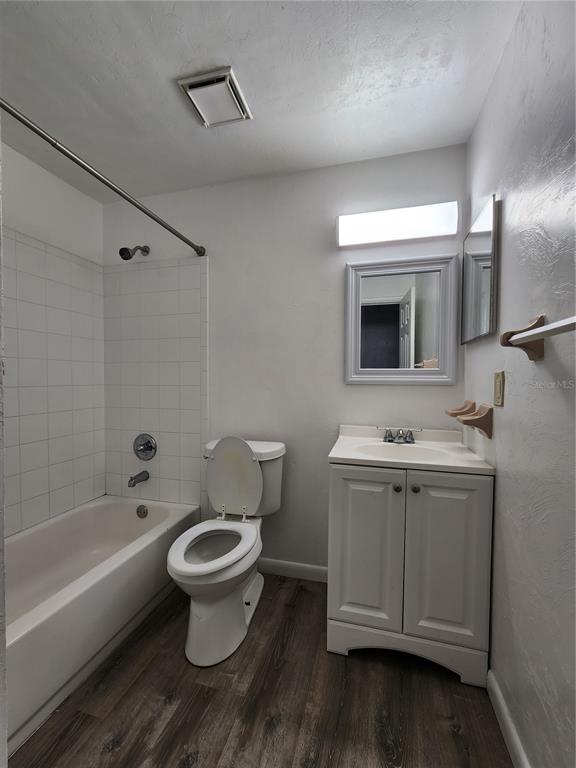 806 Southwest 64th Terrace, Unit C Gainesville, FL 32607 - Photo 19 of 28 a bathroom with a toilet sink and mirror