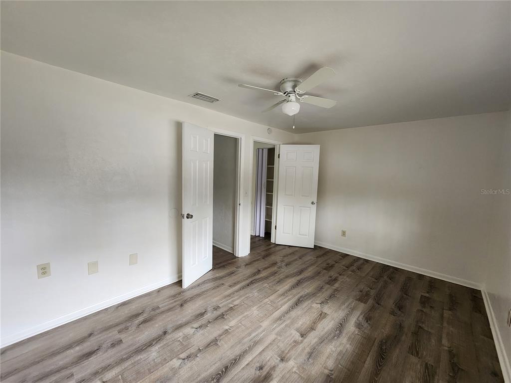 806 Southwest 64th Terrace, Unit C Gainesville, FL 32607 - Photo 25 of 28 wooden floor in an empty room