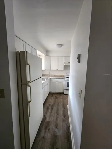 a kitchen with a refrigerator a sink and dishwasher