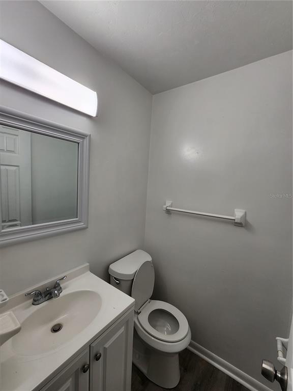 806 Southwest 64th Terrace, Unit C Gainesville, FL 32607 - Photo 5 of 28 a bathroom with a sink and a toilet
