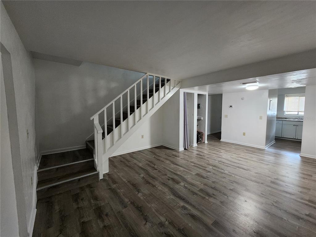 806 Southwest 64th Terrace, Unit C Gainesville, FL 32607 - Photo 9 of 28 a view of entryway and hall with wooden floor