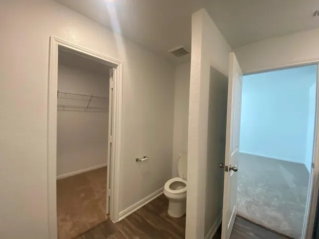 a bathroom with a granite countertop sink