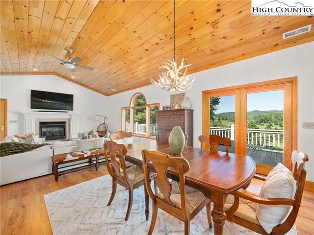 a outdoor space with lots of furniture and a chandelier