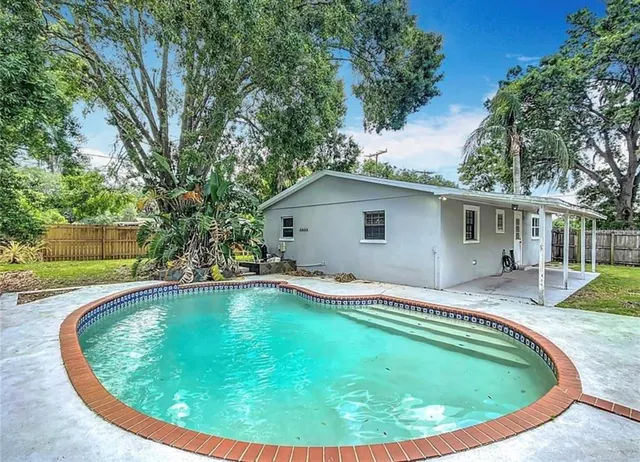 a view of a house with swimming pool