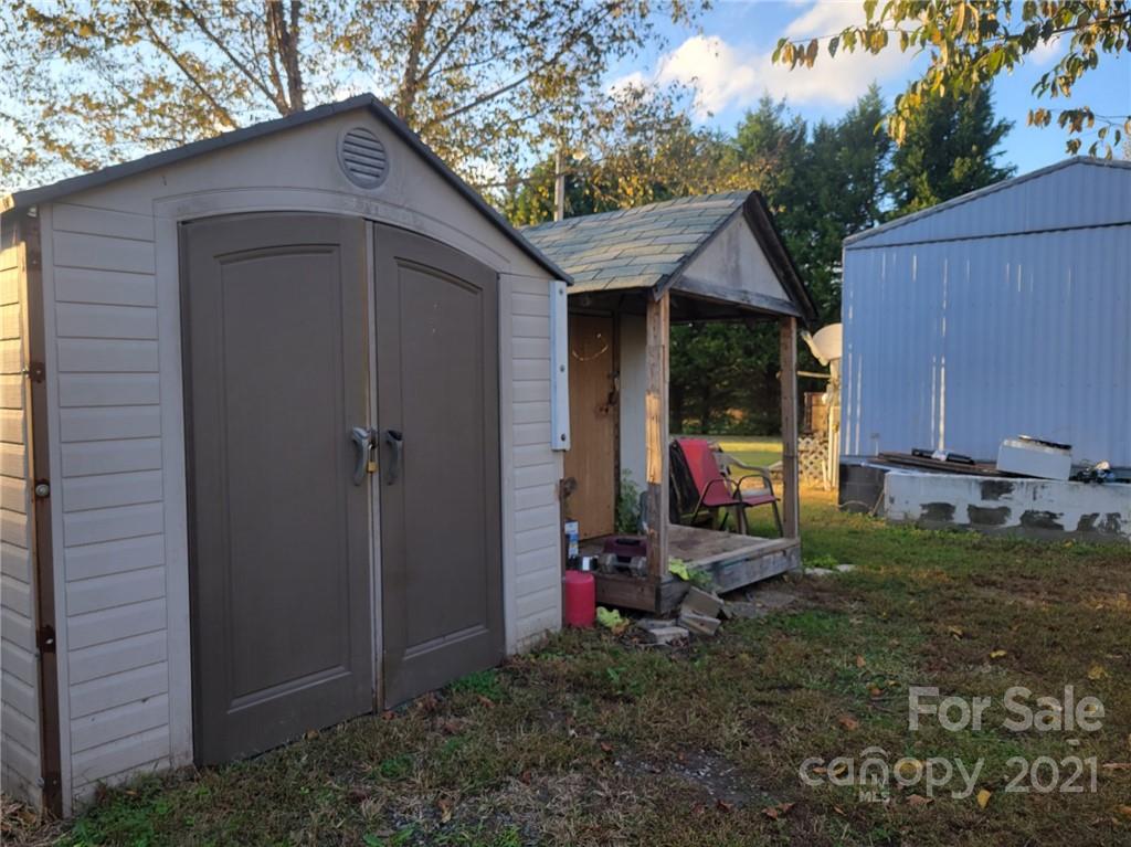 7133 Lingerfelt Road Vale, NC 28168 - Photo 22 of 23 a view of a house with a yard and a wooden fence