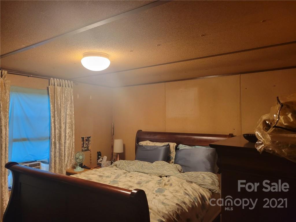 7133 Lingerfelt Road Vale, NC 28168 - Photo 10 of 23 a bedroom with a bed and a night stand