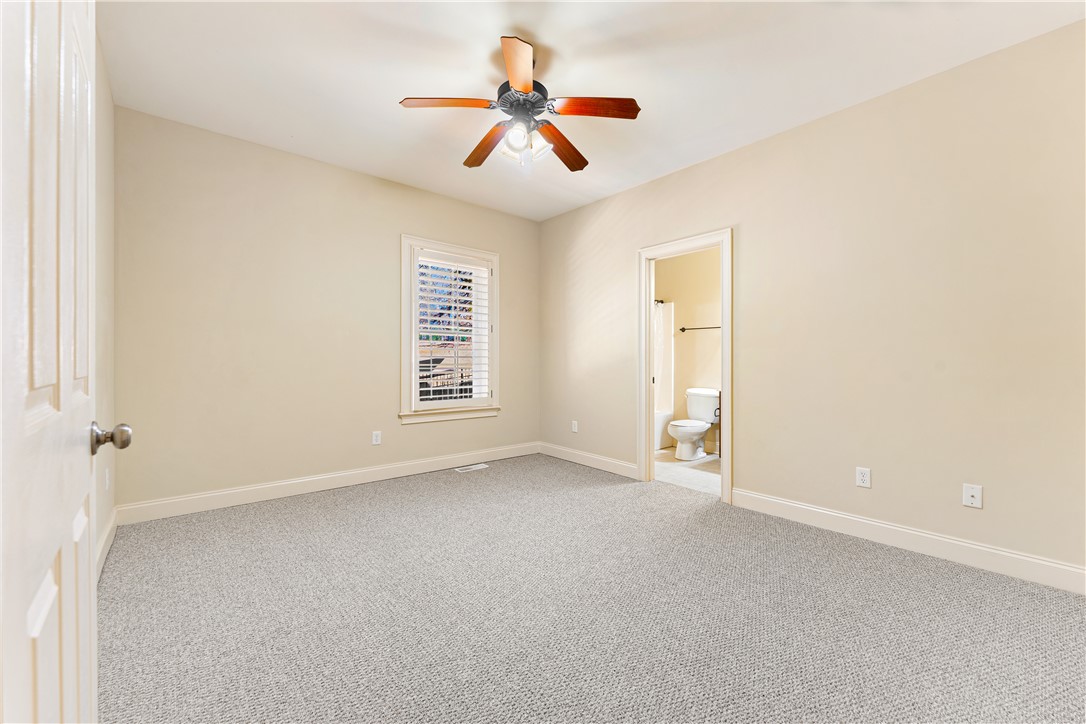 109 Limelight Drive Anderson, SC 29621 - Photo 17 of 34 This airy bedroom offers a comfortable retreat with soft carpeting and an adjacent private bathroom.