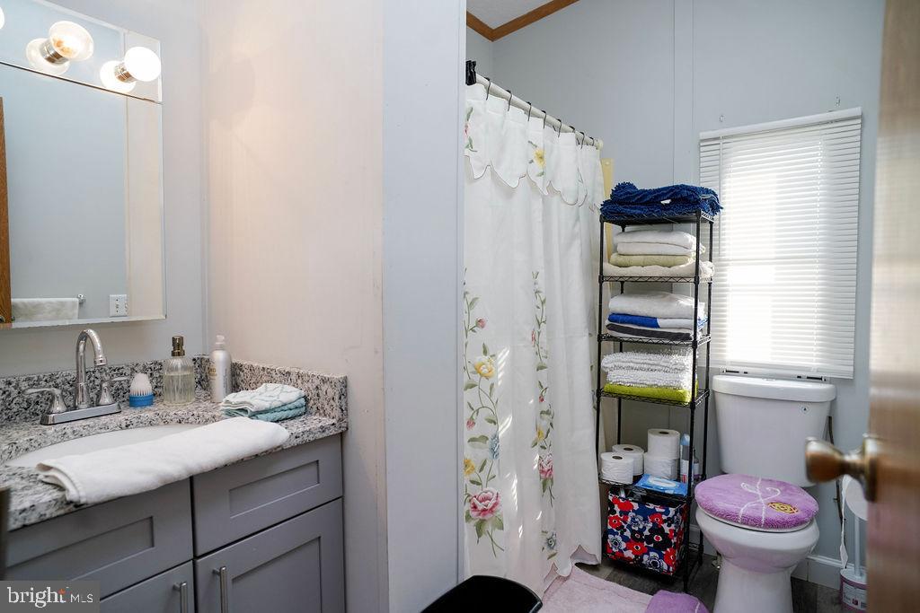 428 Pollack Drive Perryman, MD 21130 - Photo 12 of 13 a bathroom with a sink toilet and shower