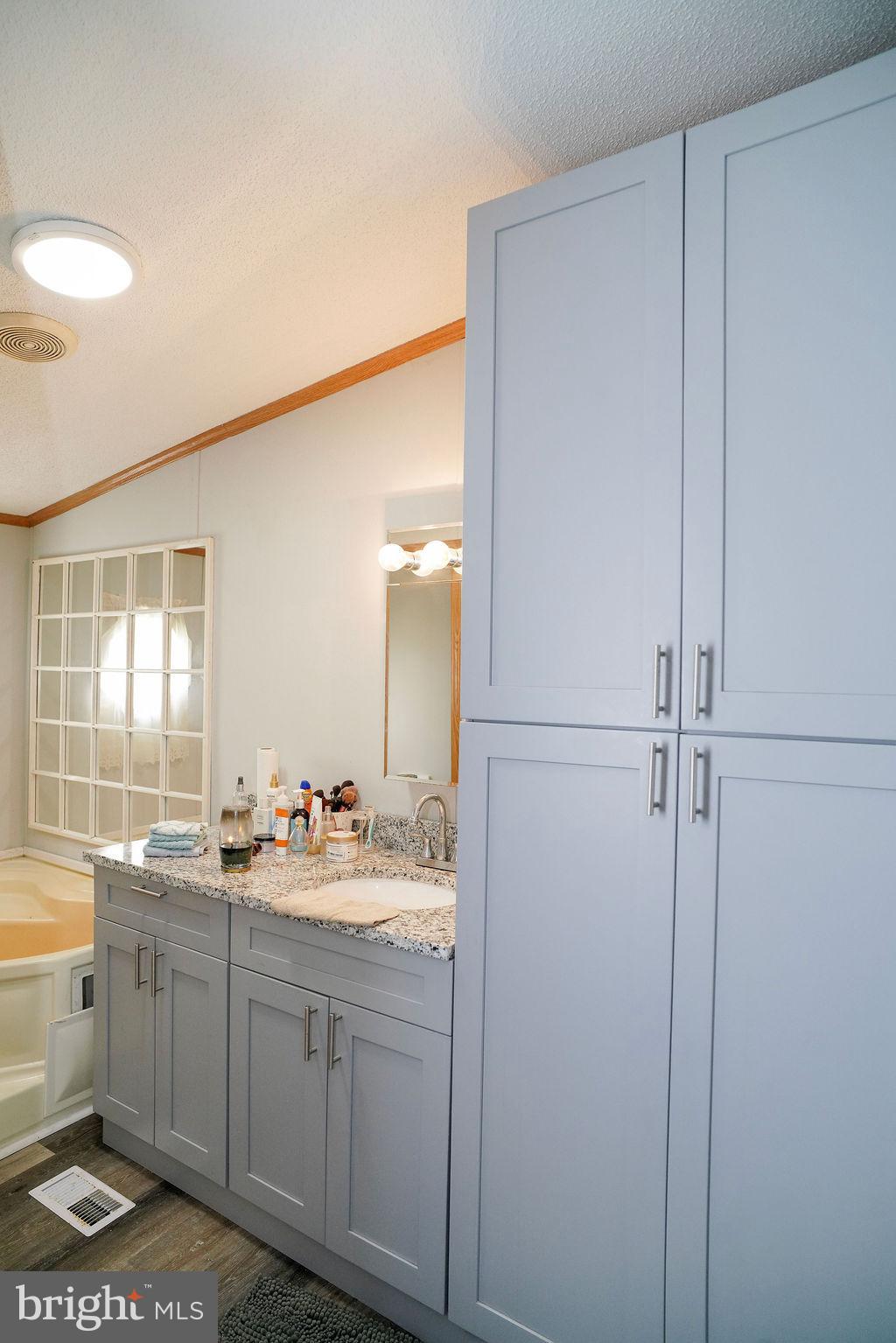 428 Pollack Drive Perryman, MD 21130 - Photo 10 of 13 a bathroom with a sink and a mirror