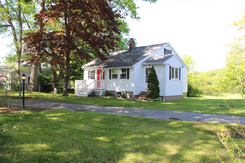 17 East Shore Road Holbrook, MA 02343 - Photo 3 of 29 a front view of house with yard and green space