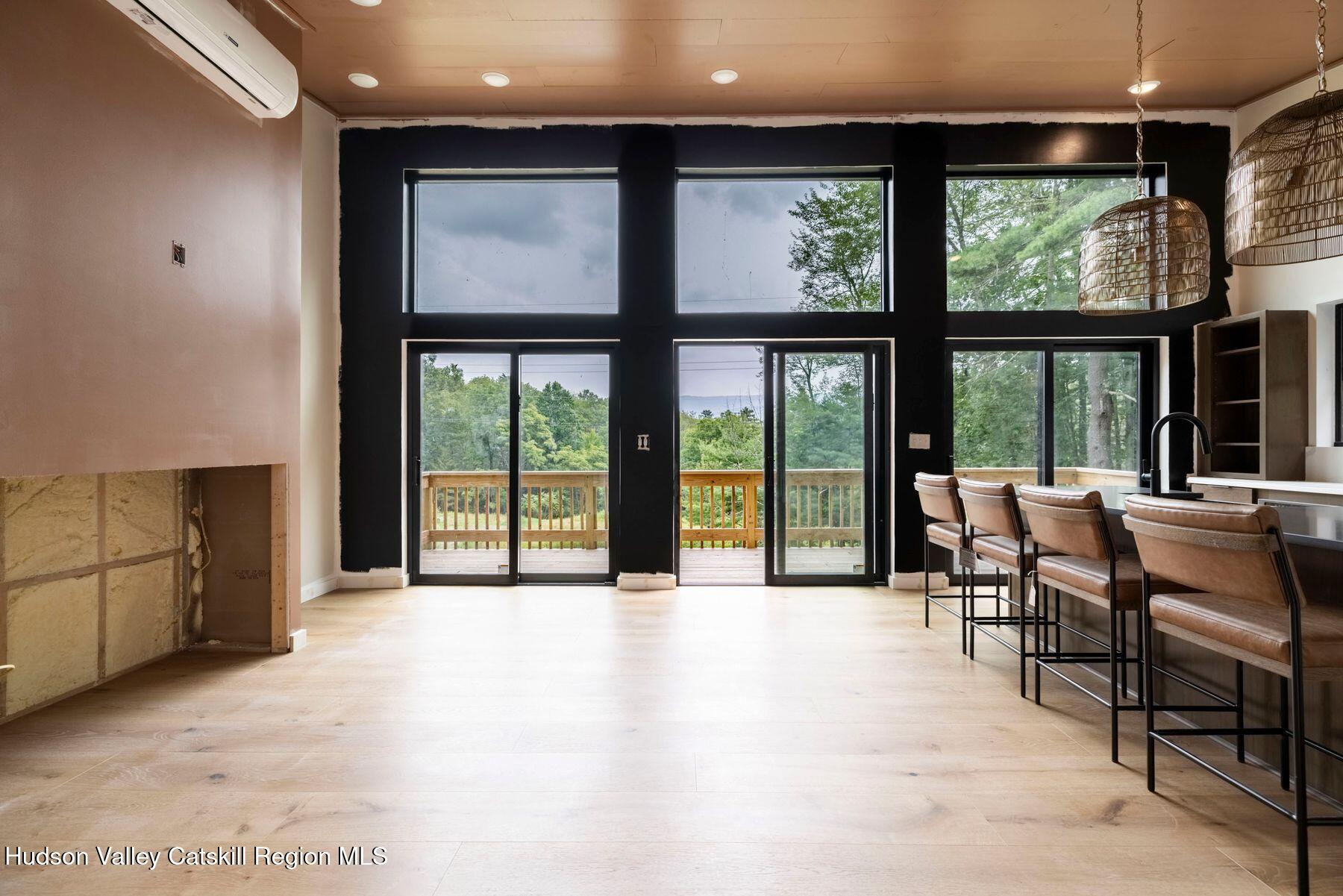 134 Irish Cape Road Napanoch, NY 12458 - Photo 15 of 47 a view of an empty room with a large window