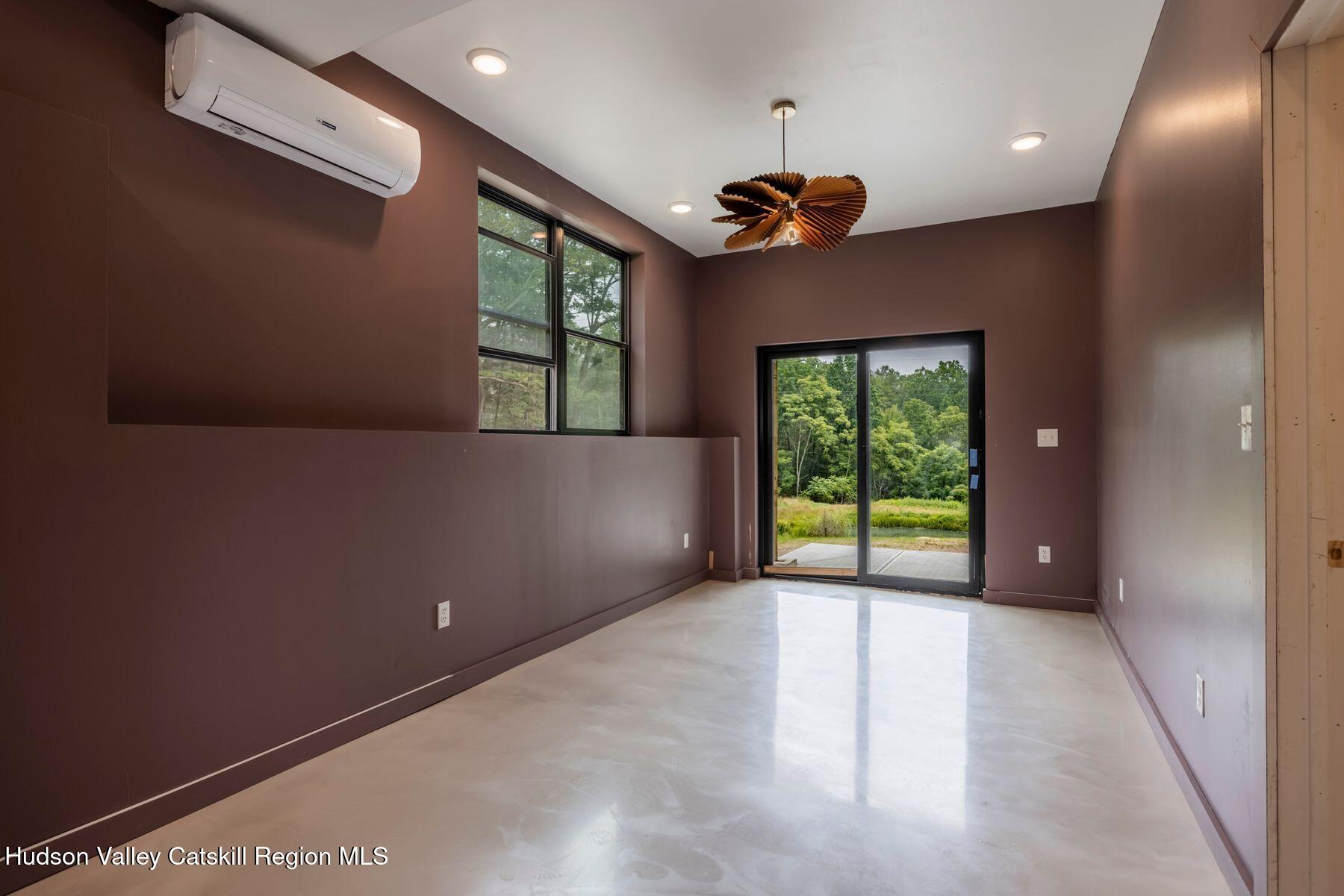 134 Irish Cape Road Napanoch, NY 12458 - Photo 19 of 47 a view of an empty room with a window