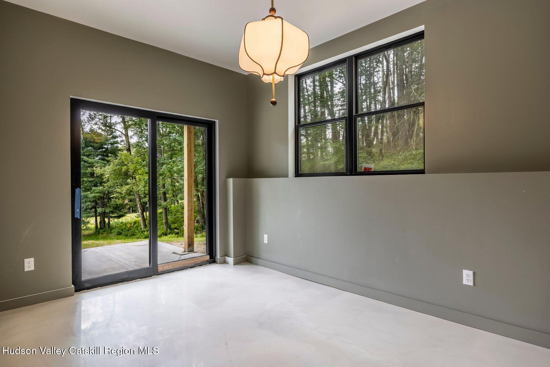 134 Irish Cape Road Napanoch, NY 12458 - Photo 20 of 47 a view of an empty room with a window