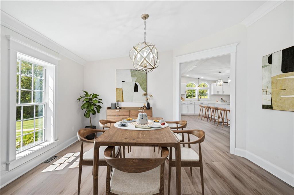 2118 Spooky Hollow Road Lower Burrell, PA 15068 - Photo 12 of 44 a view of a dining room with furniture window and wooden floor
