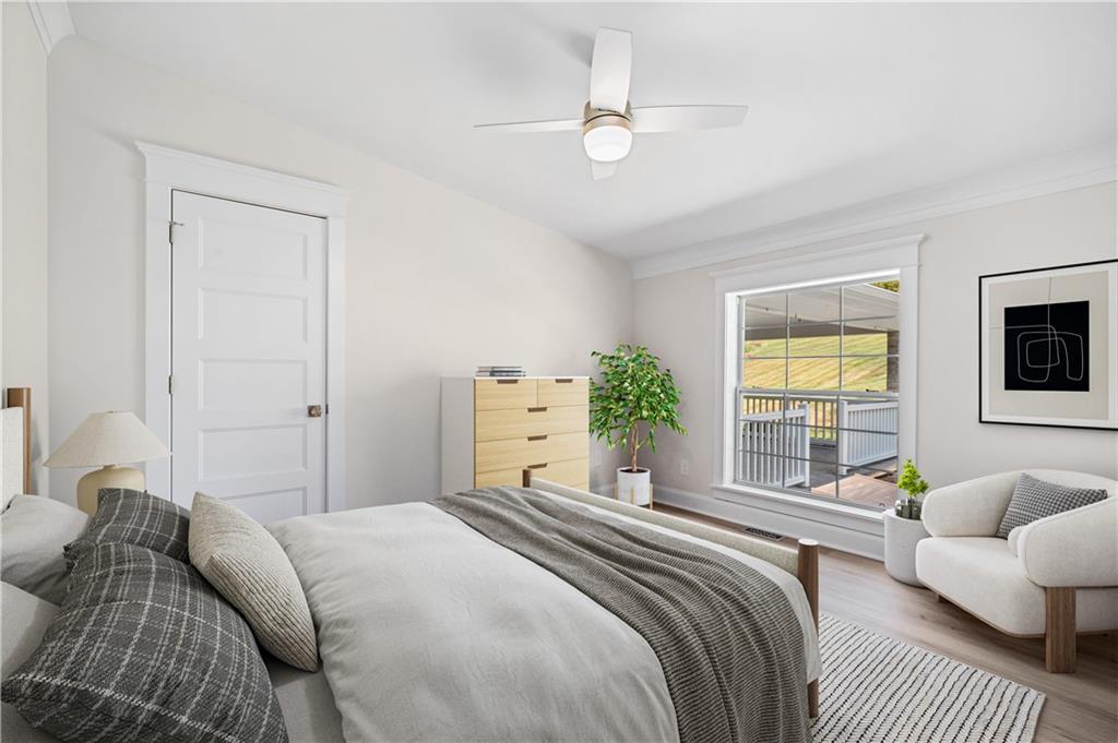 2118 Spooky Hollow Road Lower Burrell, PA 15068 - Photo 22 of 44 a bedroom with a balcony a bed and a couch