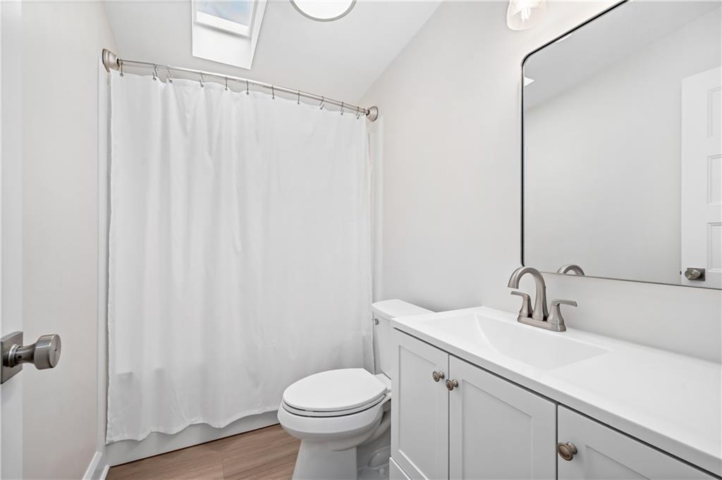2118 Spooky Hollow Road Lower Burrell, PA 15068 - Photo 24 of 44 a bathroom with a sink a toilet and shower