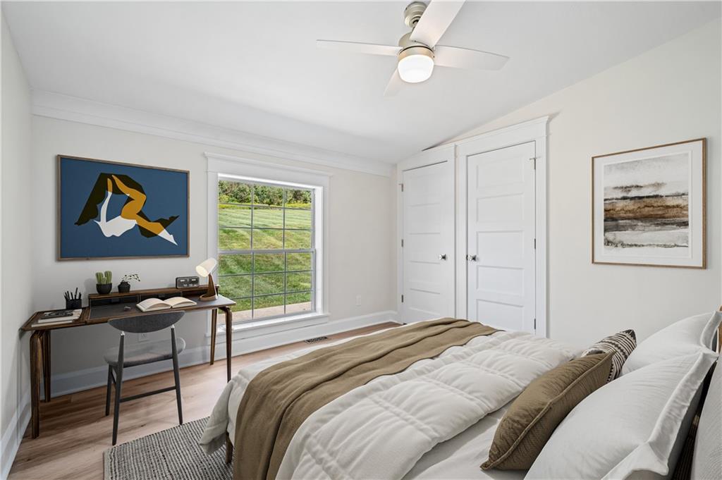 2118 Spooky Hollow Road Lower Burrell, PA 15068 - Photo 25 of 44 a bedroom with a bed and a window