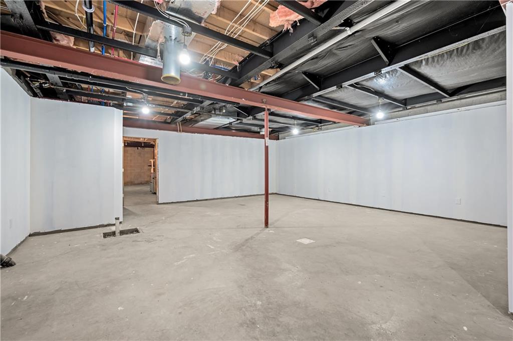 2118 Spooky Hollow Road Lower Burrell, PA 15068 - Photo 31 of 44 a view of a room with gym equipment