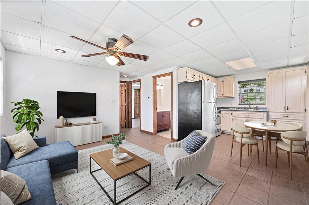 2118 Spooky Hollow Road Lower Burrell, PA 15068 - Photo 39 of 44 a living room with furniture and a flat screen tv