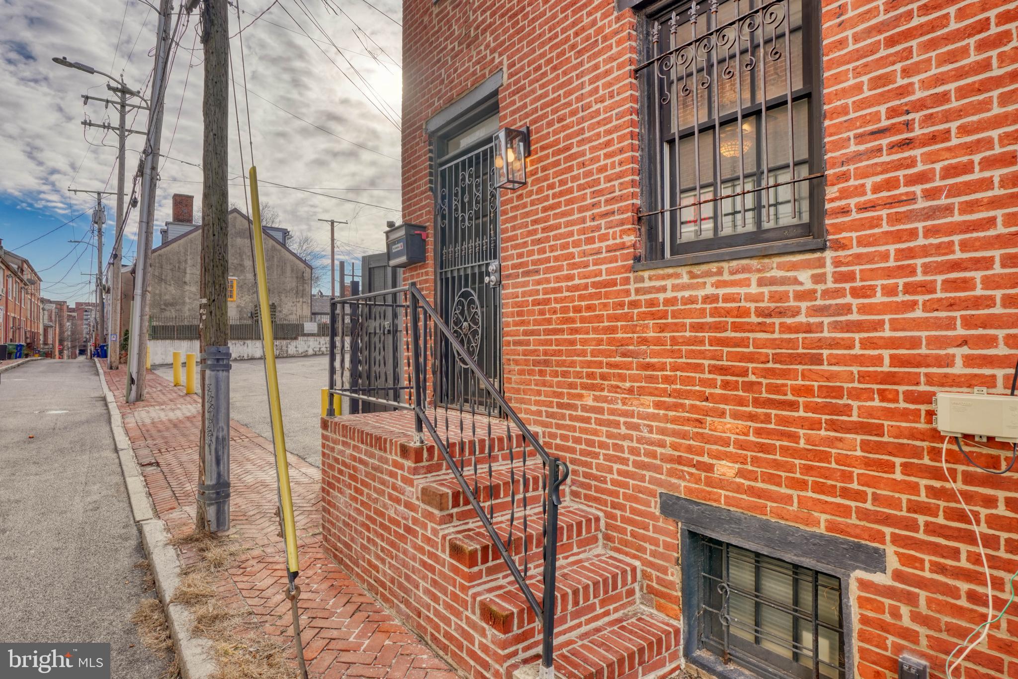 a view of a brick building with many windows