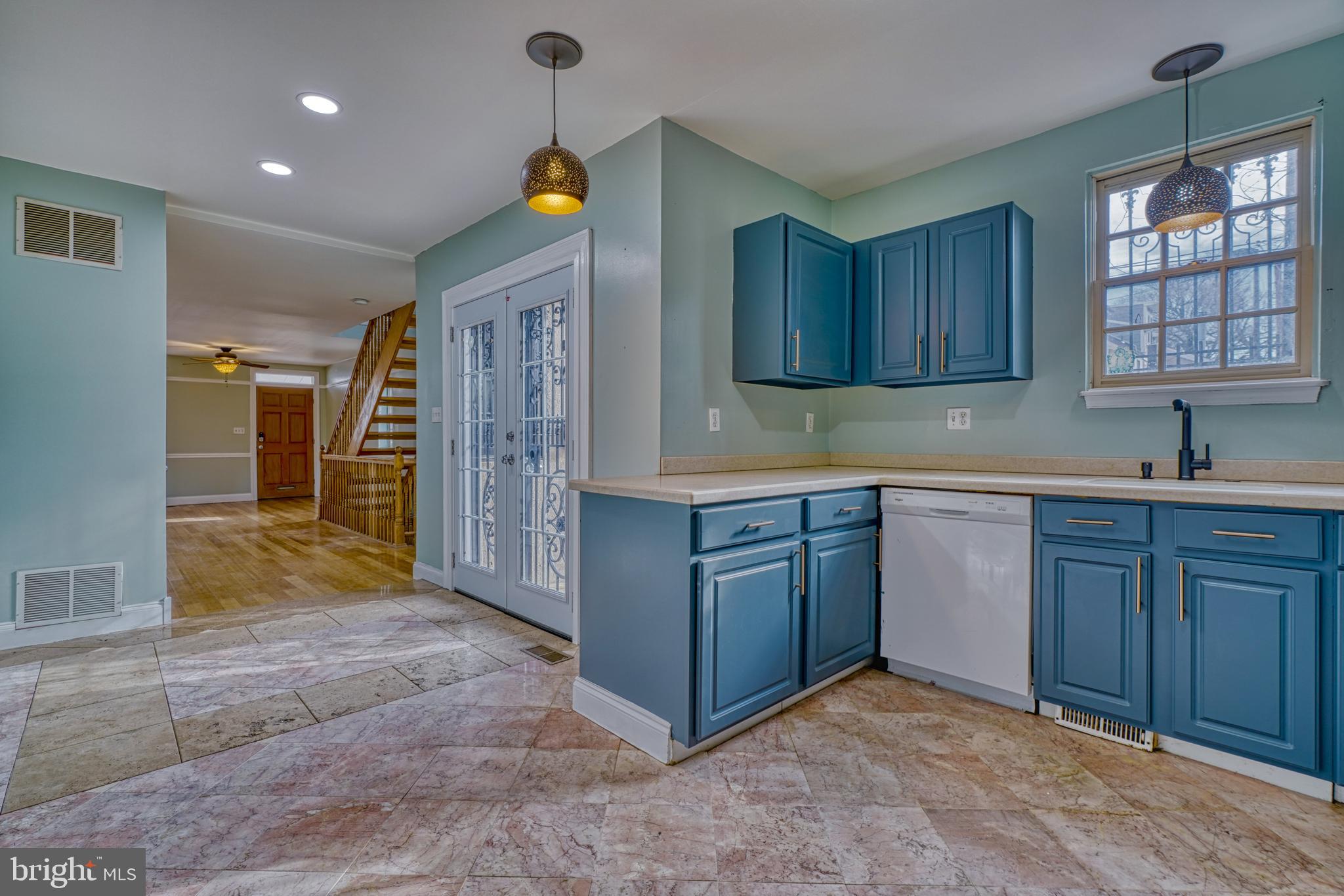 644 Jasper Street Baltimore, MD 21201 - Photo 11 of 27 a kitchen with stainless steel appliances granite countertop a sink and cabinets