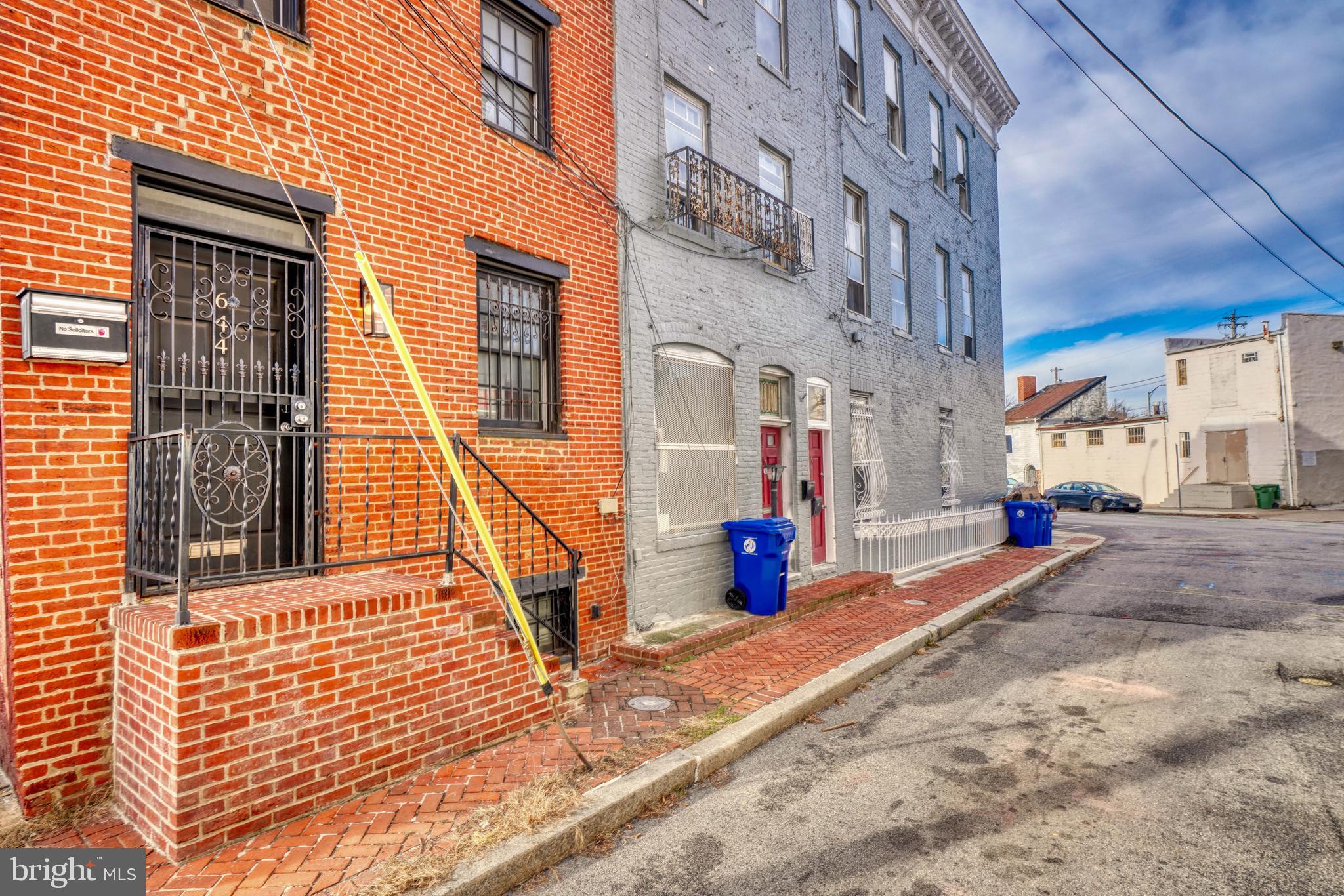 644 Jasper Street Baltimore, MD 21201 - Photo 3 of 27 a view of a brick building with many windows